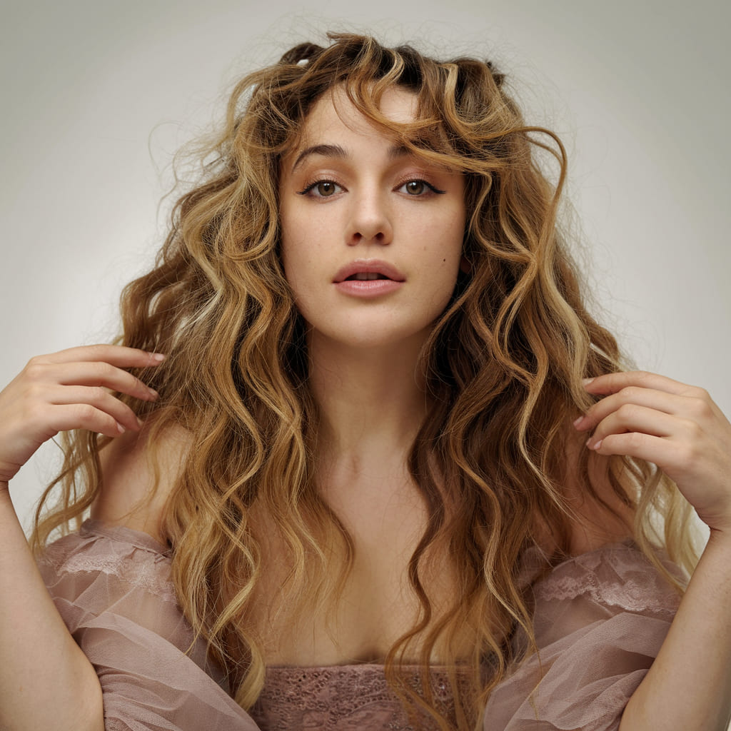 Voluminous Curls with Wispy Curtain Bangs